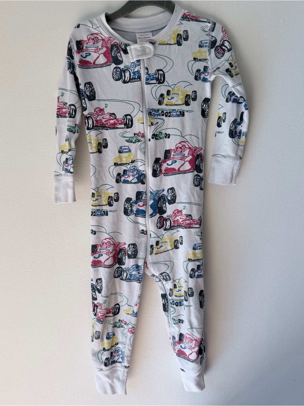 Hanna Andersson White Footed One-Piece with Red, Blue & Yellow Race Cars